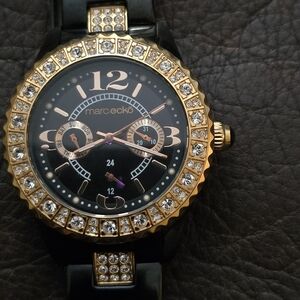 Marc Ecko womens E17536L1 black and gold‎ with gem accents. Stainless steel